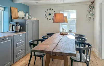 a dining room with a wooden table and chairs at 2 Bedroom Beautiful Home In Vinderup in Vinderup