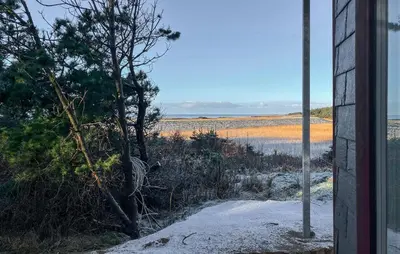 a view of the beach from a house at Beach Front Home In Thyholm With Sauna in Thyholm