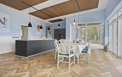 a kitchen and dining room with a table and chairs at Beach Front Home In Thyholm With Sauna in Thyholm