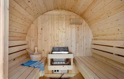 an inside of a sauna with a stove in it at Amazing Home In Thyborøn With Sauna in Thyborøn