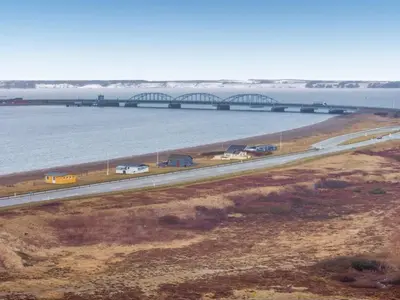 a bridge over a river with cars on a highway at Holiday Home Nyalle - 50m to the fjord by Interhome in Struer