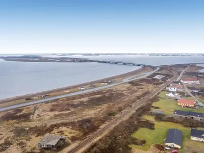an aerial view of a road next to the ocean at Holiday Home Nyalle - 50m to the fjord by Interhome in Struer