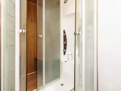 a bathroom with a shower with a glass door at 6 person holiday home in Spøttrup in Spottrup