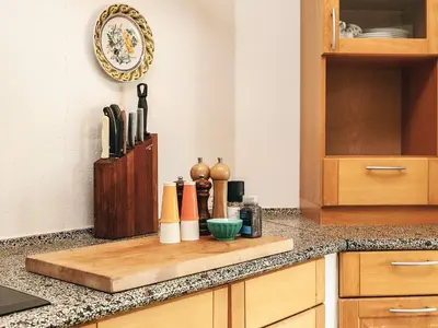 a kitchen counter with a wooden cutting board on it at 6 person holiday home in Spøttrup in Spottrup