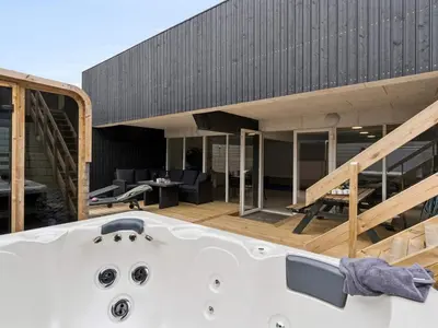 a bath tub in front of a house at 5 star holiday home in Blokhus in Blokhus