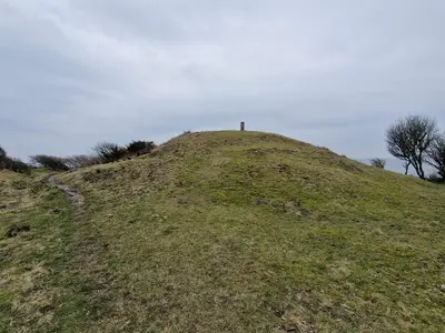 a cross on top of a grassy hill at 4 star holiday home in Spøttrup in Lihme