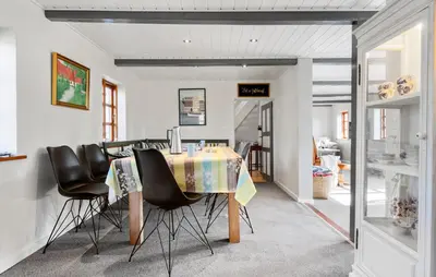 a dining room with a table and some chairs at Nice Home In Farsø With Wifi in Farsø