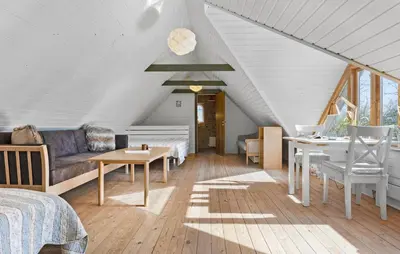 a living room with a couch and a table at Nice Home In Farsø With Wifi in Farsø