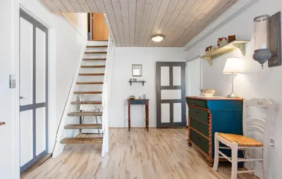 a room with a staircase and a desk and a chair at Nice Home In Farsø With Wifi in Farsø