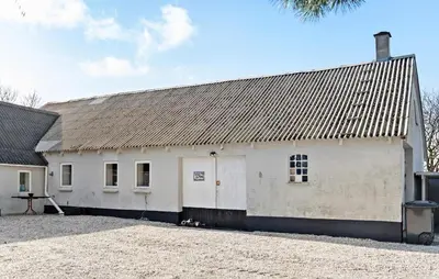 a white barn with a gray roof at Amazing Apartment In Thisted With Wifi in Thisted