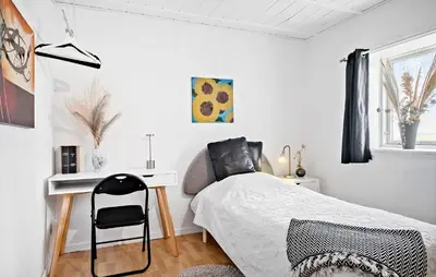 a bedroom with a bed with a desk and a chair at Amazing Apartment In Thisted With Wifi in Thisted