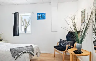 a bedroom with a bed and a vase with a plant at Amazing Apartment In Thisted With Wifi in Thisted