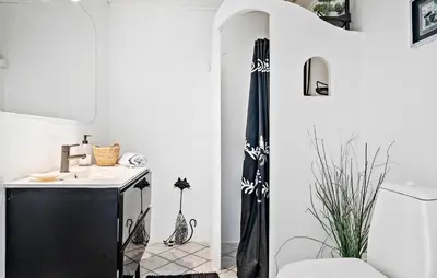 a bathroom with a sink and a black umbrella at Amazing Apartment In Thisted With Wifi in Thisted