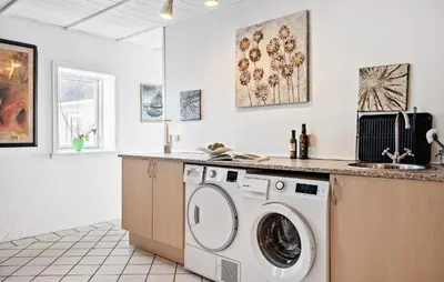 a laundry room with a washer and a sink at Amazing Apartment In Thisted With Wifi in Thisted
