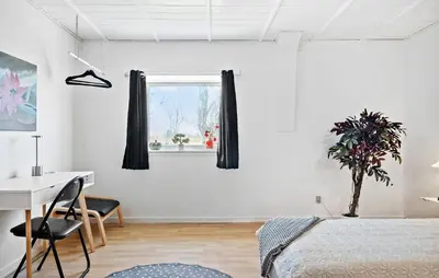 a bedroom with a bed and a desk and a window at Amazing Apartment In Thisted With Wifi in Thisted