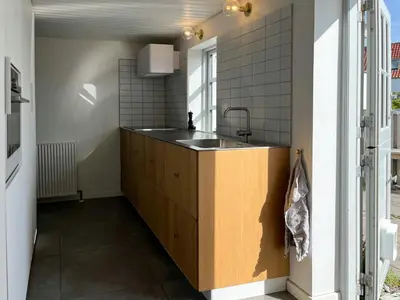a kitchen with a sink and a counter at North Sea Atmosphere On The Farm In Klitmøller in Torsted