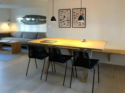a table and chairs in a living room at North Sea Atmosphere On The Farm In Klitmøller in Torsted