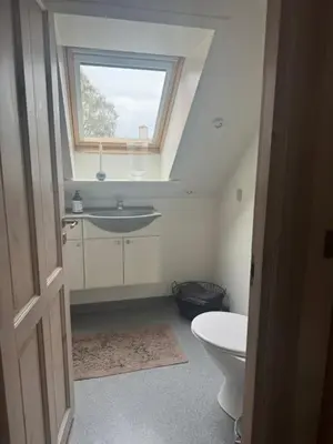 a bathroom with a sink and a window at Svane's Air-bnb in Nykøbing Mors