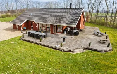 an aerial view of a small cabin with a deck at Cozy Home In Spøttrup With Sauna in Spottrup