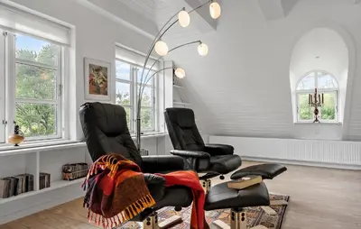 two black chairs in a room with windows at Stunning Home In Fjerritslev With Sauna in Fjerritslev