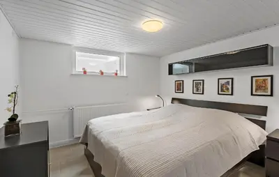 a white bedroom with a bed and a window at Stunning Home In Fjerritslev With Sauna in Fjerritslev
