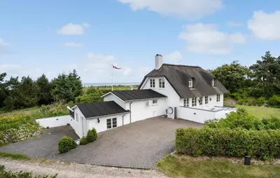 a large white house with a large driveway at Stunning Home In Fjerritslev With Sauna in Fjerritslev