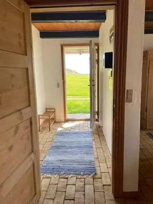 an open hallway with a door leading to a patio at Surfreservatet i Nationalpark Thy in Hanstholm