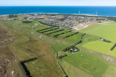 an aerial view of a golf course near the ocean at Surfreservatet i Nationalpark Thy in Hanstholm