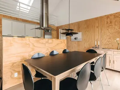 a dining room with a black table and chairs at 4 star holiday home in Brovst in Brovst