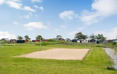 a baseball field with houses in the background at Stunning Home In Vestervig With Sauna in Vestervig