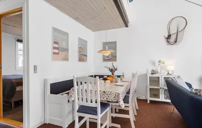 a dining room with a table and chairs at Stunning Home In Vestervig With Sauna in Vestervig