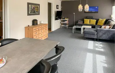 a living room with a table and a couch at Gorgeous Home In Spøttrup With Wifi in Spottrup