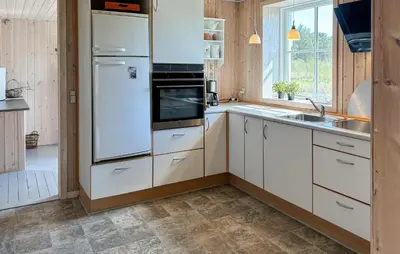 a kitchen with white appliances and a sink at 3 Bedroom Nice Home In Fjerritslev in Fjerritslev