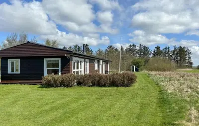 a small house in the middle of a field at 3 Bedroom Nice Home In Fjerritslev in Fjerritslev