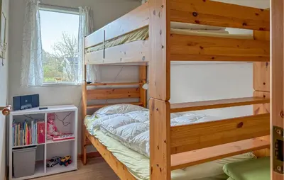 a bedroom with two bunk beds and a window at Lovely Home In Fjerritslev With Wifi in Fjerritslev