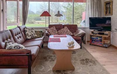 a living room with couches and a coffee table at Lovely Home In Fjerritslev With Wifi in Fjerritslev