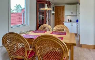 a dining room with a wooden table and chairs at Lovely Home In Fjerritslev With Wifi in Fjerritslev