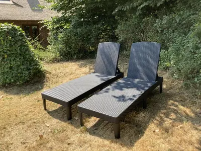 two chairs sitting next to each other in a yard at PipOp - the place where you find your soul again in Struer