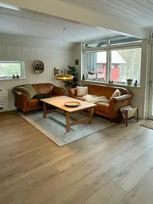 a living room with a couch and a table at Hidden Gem By Thy National Park