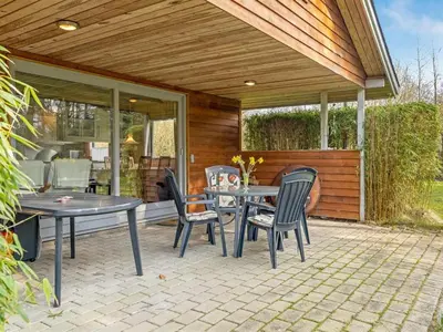 a patio with a table and chairs on a patio at Holiday Home Franzisca - 200m to the fjord by Interhome in Roslev
