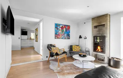 a living room with a couch and a fireplace at 3 Bedroom Pet Friendly Home In Løkken in Løkken