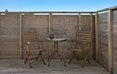 two chairs and a table on a patio at 3 Bedroom Gorgeous Home In Lemvig in Lemvig