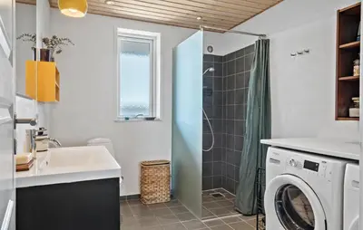 a bathroom with a sink and a washing machine at 3 Bedroom Gorgeous Home In Lemvig in Lemvig