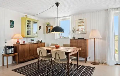 a dining room with a table and chairs at 3 Bedroom Gorgeous Home In Lemvig in Lemvig