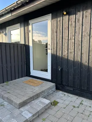 a front door of a house with a window at Nyrenoveret,hyggeligt og centralt hus in Holstebro