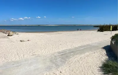 a sandy beach with the ocean in the background at Cozy Home In Thyborøn With Wifi in Thyborøn