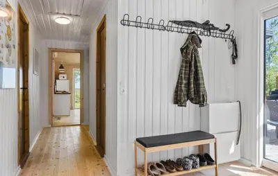 a hallway of a home with white walls and a refrigerator at Beautiful Home In Fur With Wifi in Fur