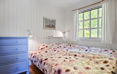 a bedroom with a bed and a dresser and a window at Beautiful Home In Fur With Wifi in Fur