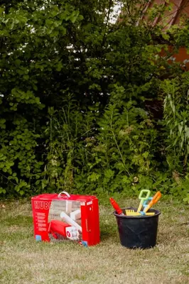 a container of utensils sitting on the grass at Lovely House Near Nature For Relaxation in Fjerritslev