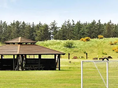a gazebo in a field with a soccer ball at 4 star holiday home in Brovst in Brovst